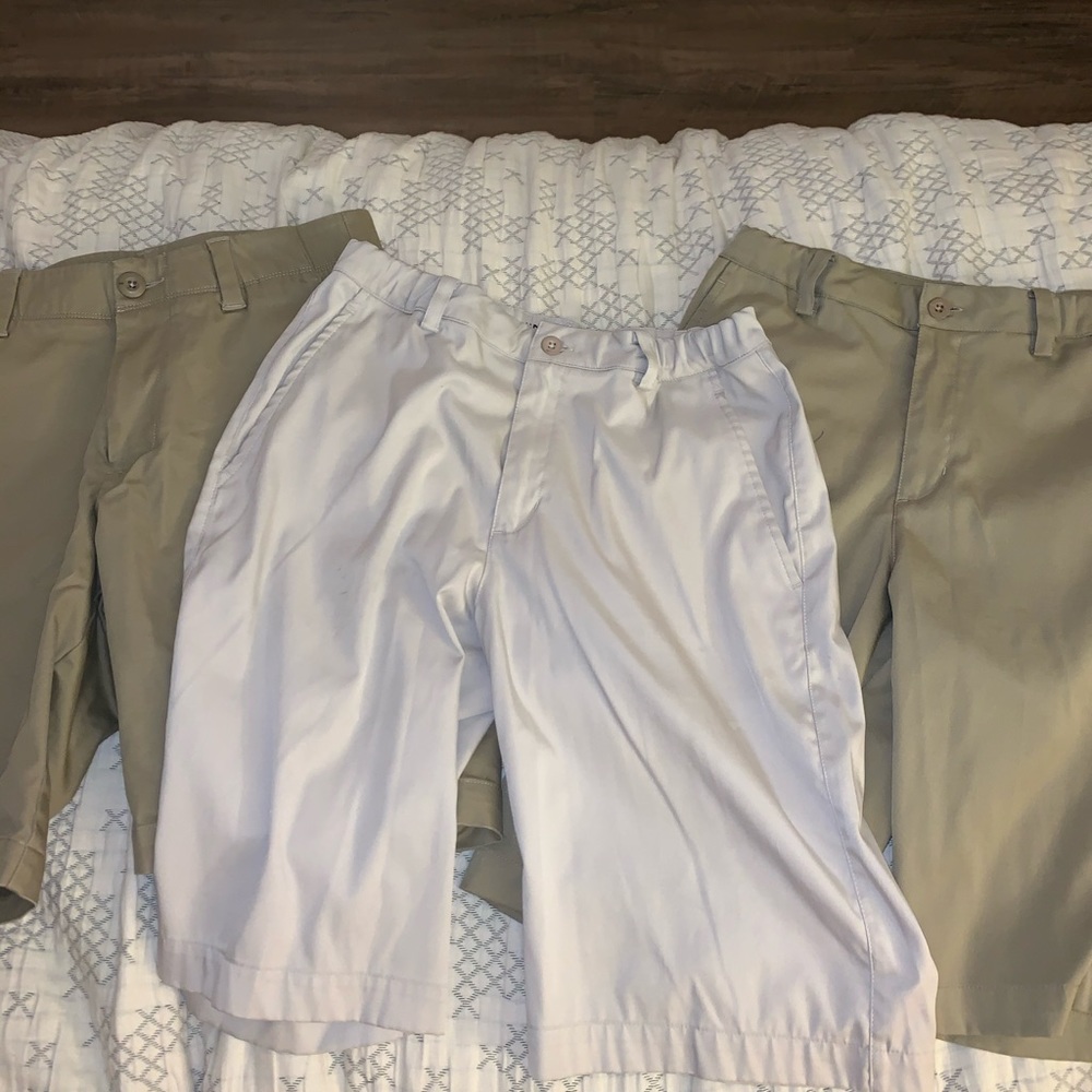 Two Nike and one Under Armour khakis